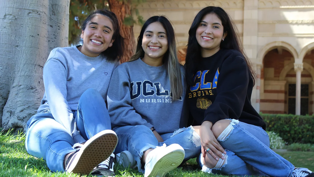 3 nursing students sitting with one another