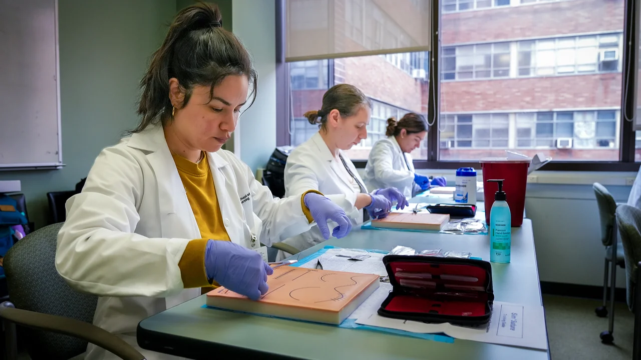Students working in the suture lab