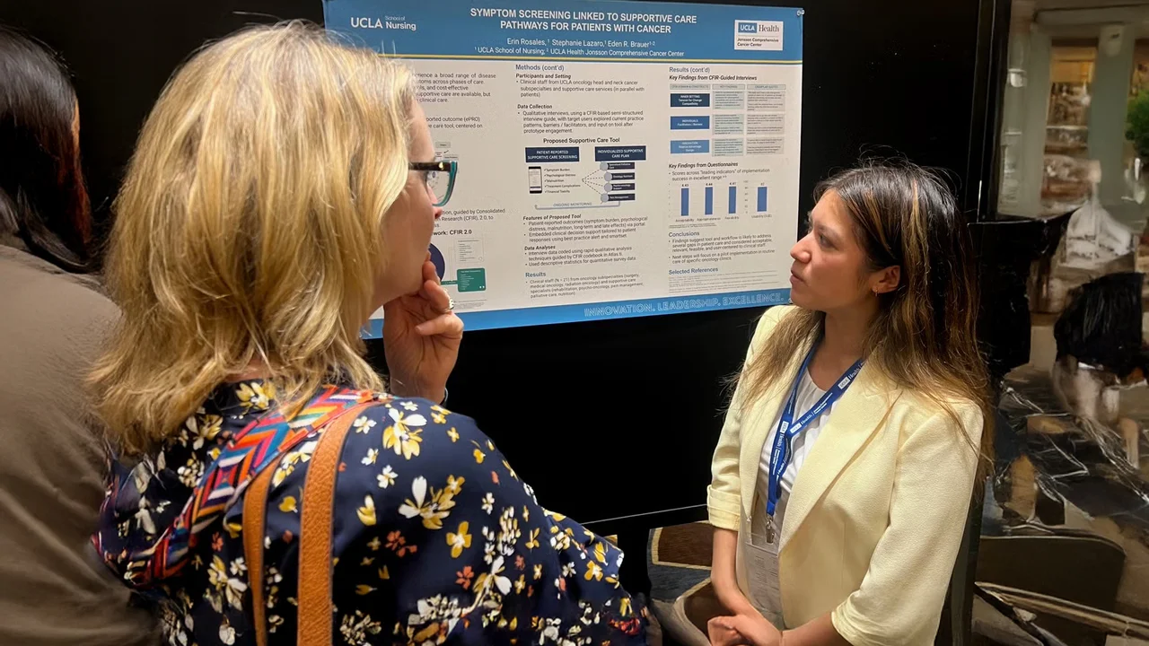 Nursing student presenting their research at a cancer symposium. 