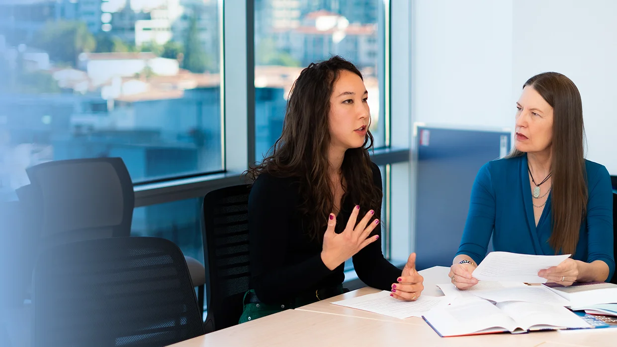 Kristen Choi and MarySue Heilemann discussing NCSP projects
