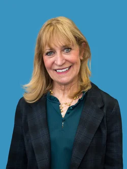 Barbara Bates-Jensen in dark grey jacket and green shirt. 