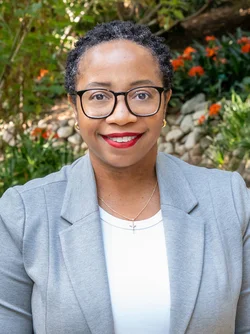 Kamala Gipson-McElroy standing in the UCLA Botanical Garden