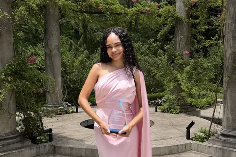 Danielle Paisley holding her NAMI Award for Young Leadership.