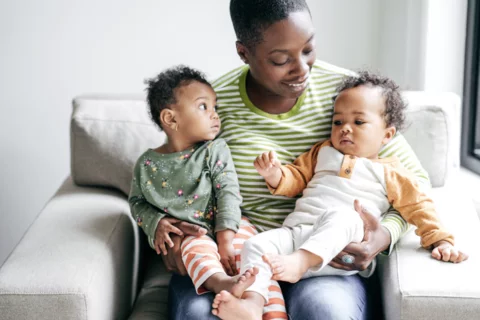 A mother with her 2 young children