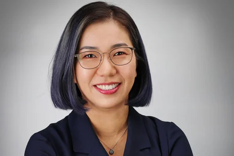 Dr. Sarah Ko headshot, wearing glasses and dark collared shirt.