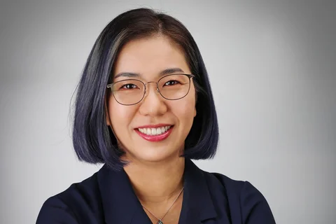 Dr. Sarah Ko headshot, wearing glasses and dark collared shirt.