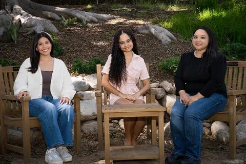 Nursing students Julie Bernardo, Vanessa Martinez, and Danielle Paisley sitting in the UCLA Botanical Garden.