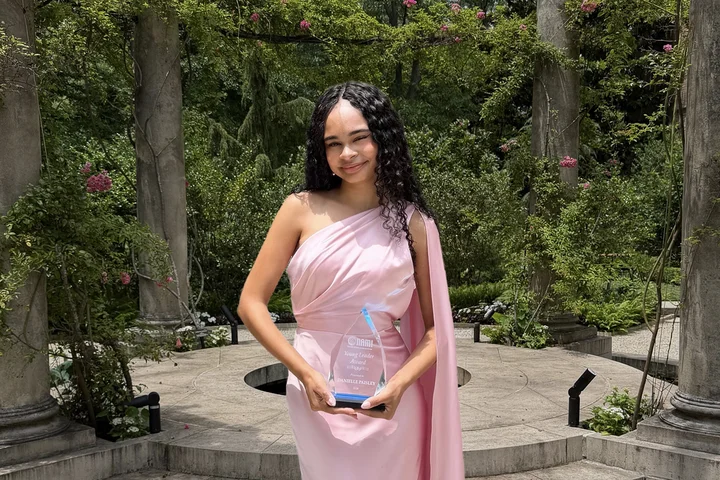 Danielle Paisley holding her NAMI Award for Young Leadership.