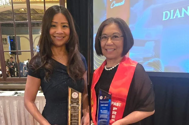 Carol Cunningham and Emma Cuenca holding their awards at the PNASC Award Ceremony. 