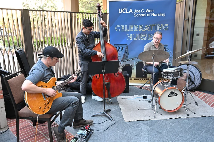 Musical trio performing at the celebration event