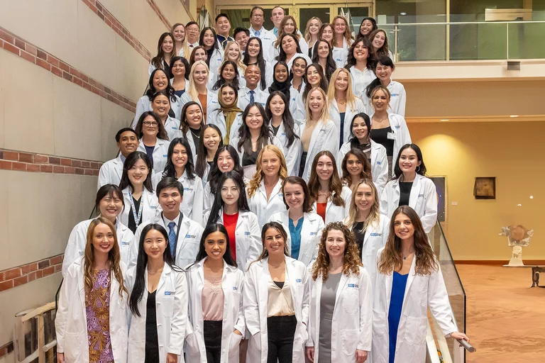 APRN students with their white coats