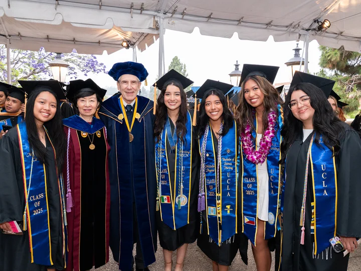 Nursing students posing with UCLA Nursing Dean Lin Zhan and UCLA Chancellor Julio Frenk