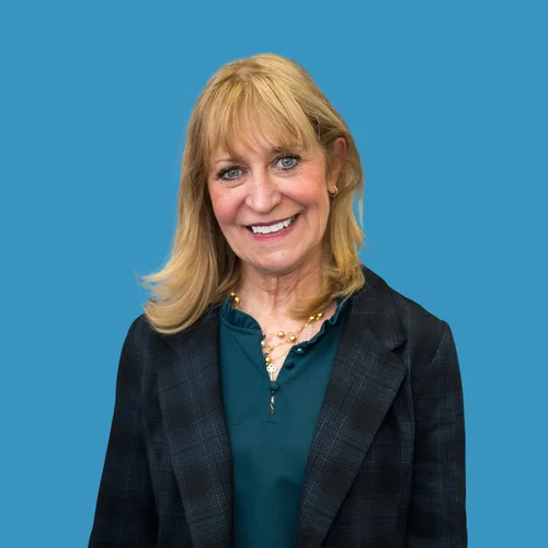 Barbara Bates-Jensen in dark grey jacket and green shirt. 