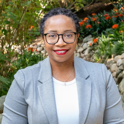 Kamala Gipson-McElroy standing in the UCLA Botanical Garden