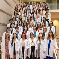APRN students with their white coats