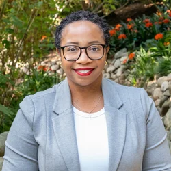 Kamala Gipson-McElroy standing in the UCLA Botanical Garden