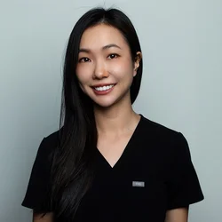 Lillian Wong wearing black scrubs