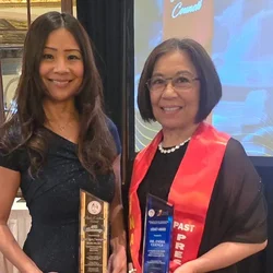 Carol Cunningham and Emma Cuenca holding their awards at the PNASC Award Ceremony. 