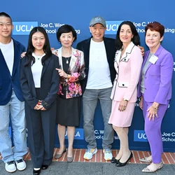 Joe C. Wen and two of his children with Dean Lin Zhan, President Johnese Spisso, and Dr. Karen Grimley