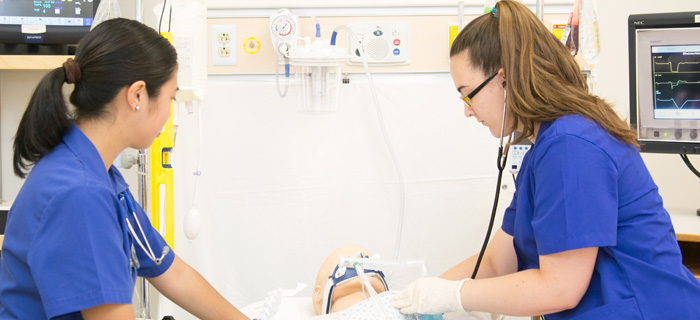Two nursing students in a hospital room