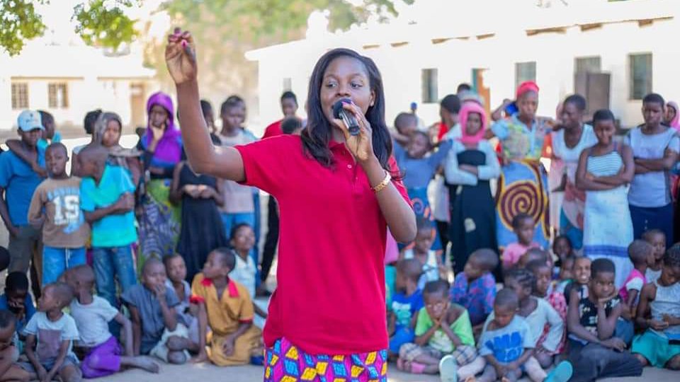 Chilungamo M’manga speaking to young girls in Malawi