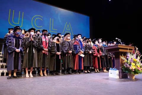 Faculty members on stage during commencement